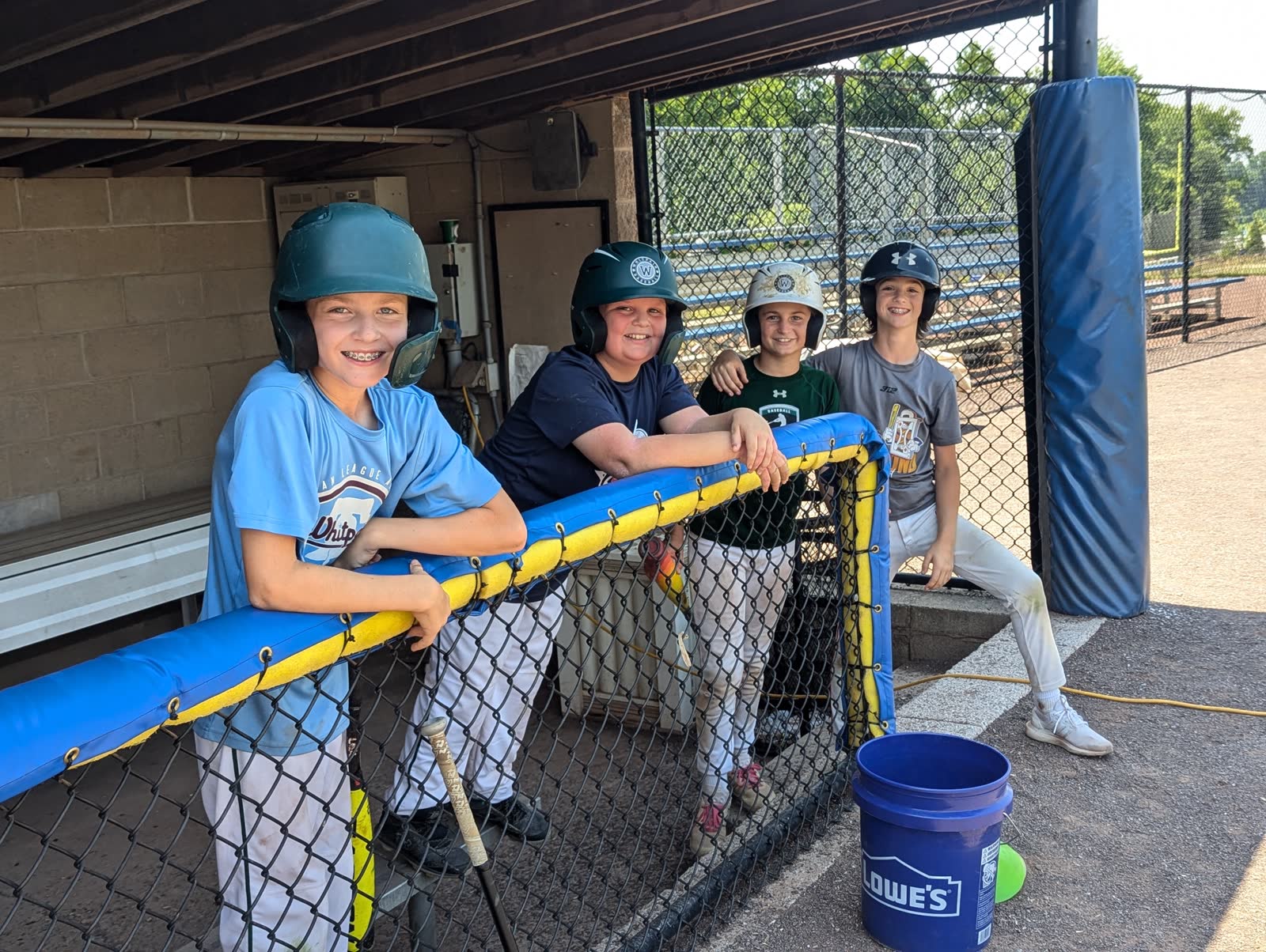 Smiling Skills Camp players in the dugout